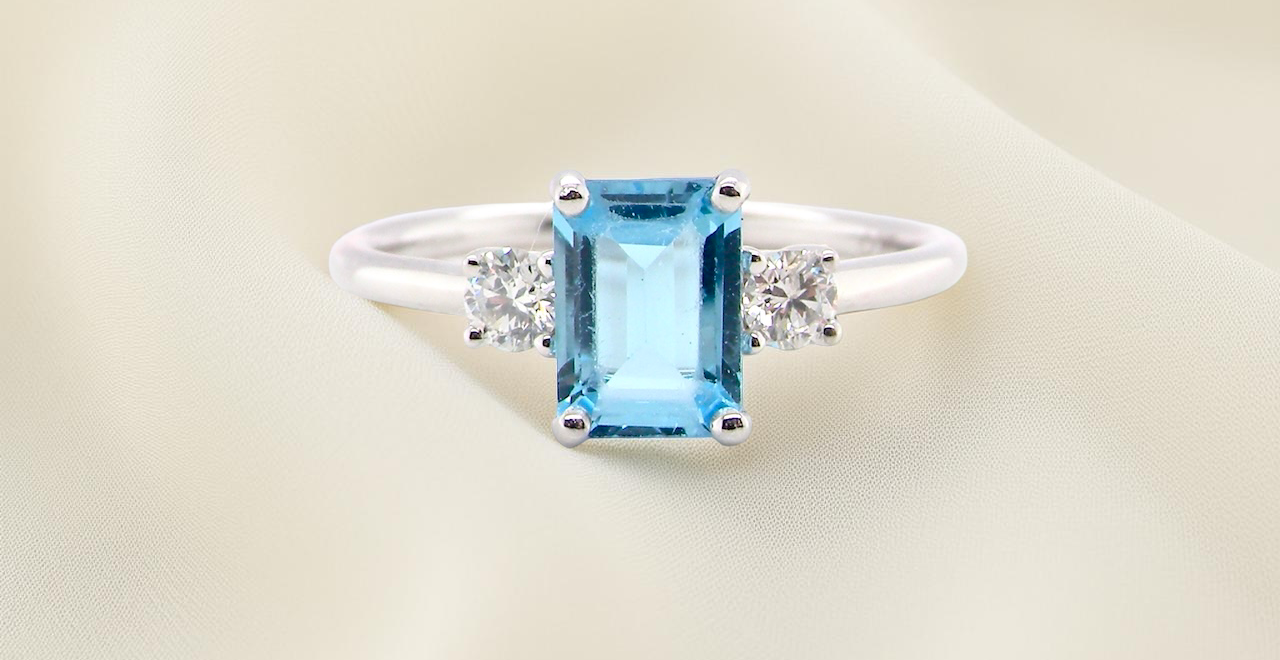A 9 carat white gold three stone ring. This ring is from our Heirloom Collection. This is when we take a stone from a pre-owned ring that is worn out, and reset it into a new setting.