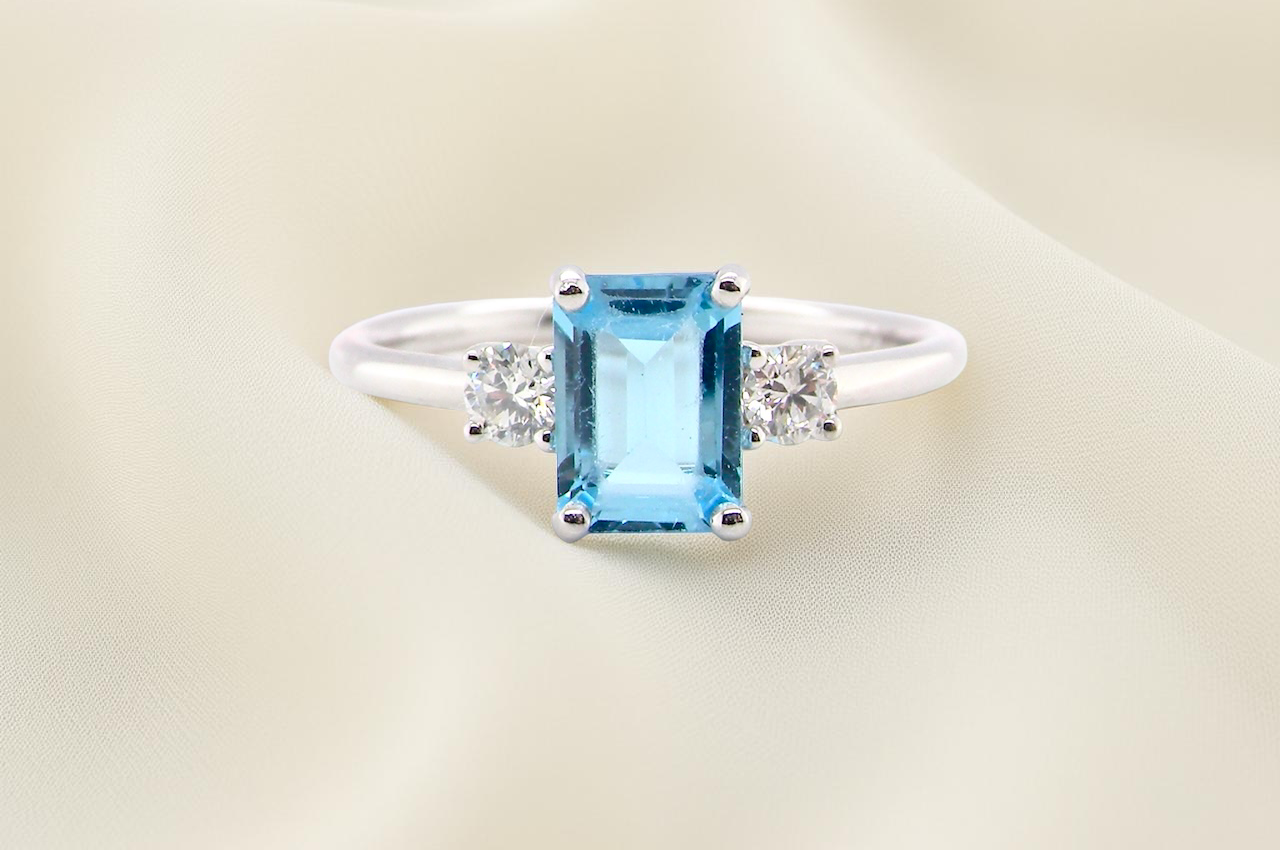 A 9 carat white gold three stone ring. This ring is from our Heirloom Collection. This is when we take a stone from a pre-owned ring that is worn out, and reset it into a new setting.
