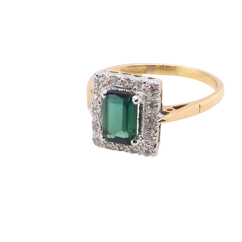 A near new cluster ring that shows no sign of wear, seems unworn.
Features a green tourmaline gemstone,