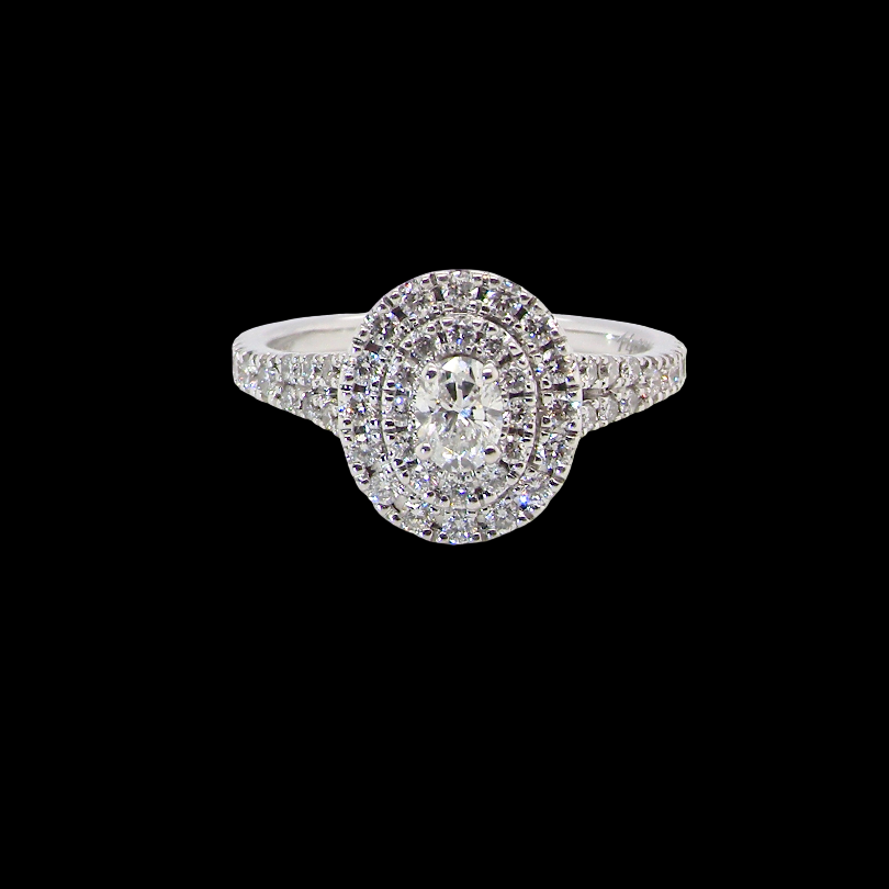 A new diamond cluster ring* An oval diamond halo cluster ring. Set with brilliant cut white diamonds,