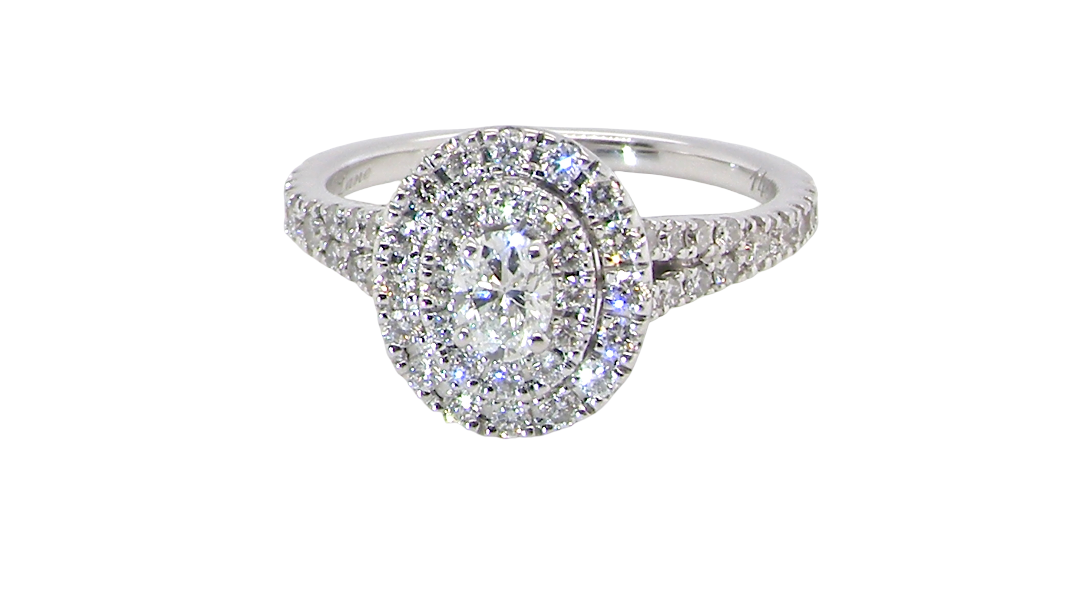 A new diamond cluster ring* An oval diamond halo cluster ring. Set with brilliant cut white diamonds, colour H-k,