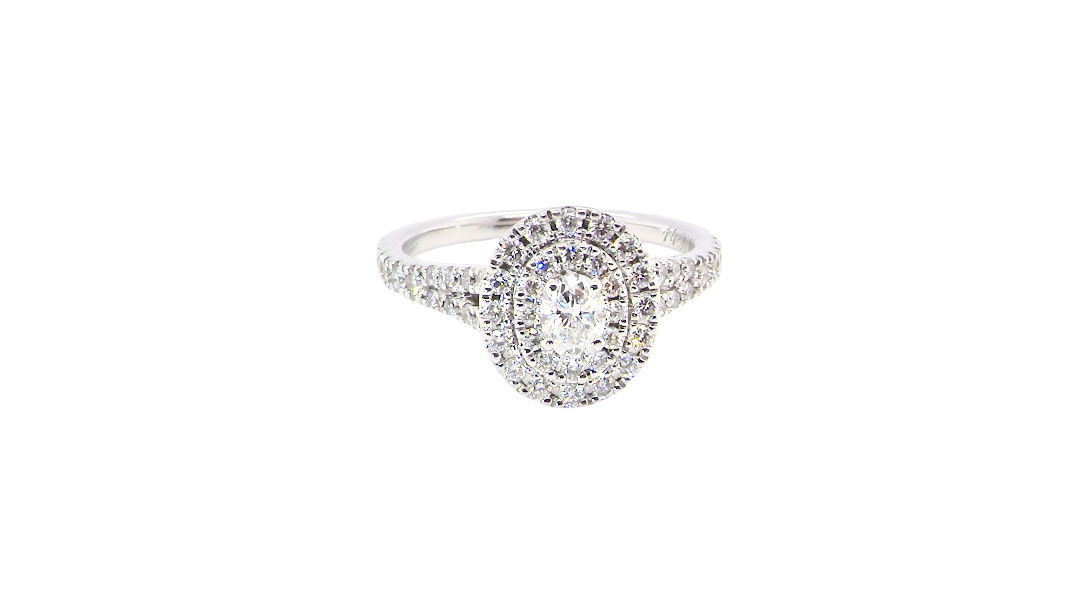 A new diamond cluster ring* An oval diamond halo cluster ring. Set with brilliant cut white diamonds, colour H-k, clarity Si.