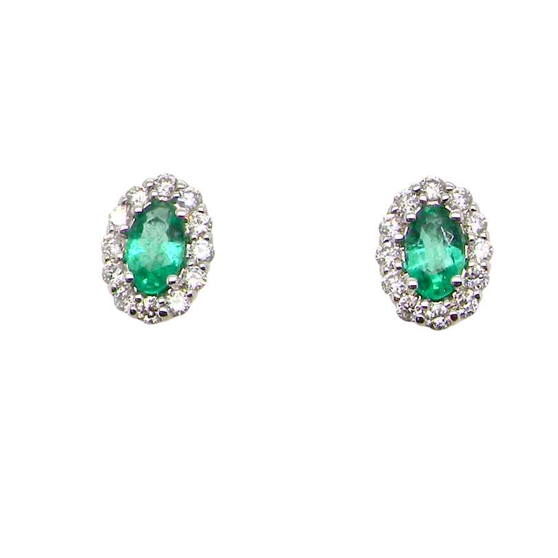 A pair of 18 carat white gold cluster earrings. The centre stone an oval cut emerald, 5x3.7mm (est 0.35 carats) deep green colour.