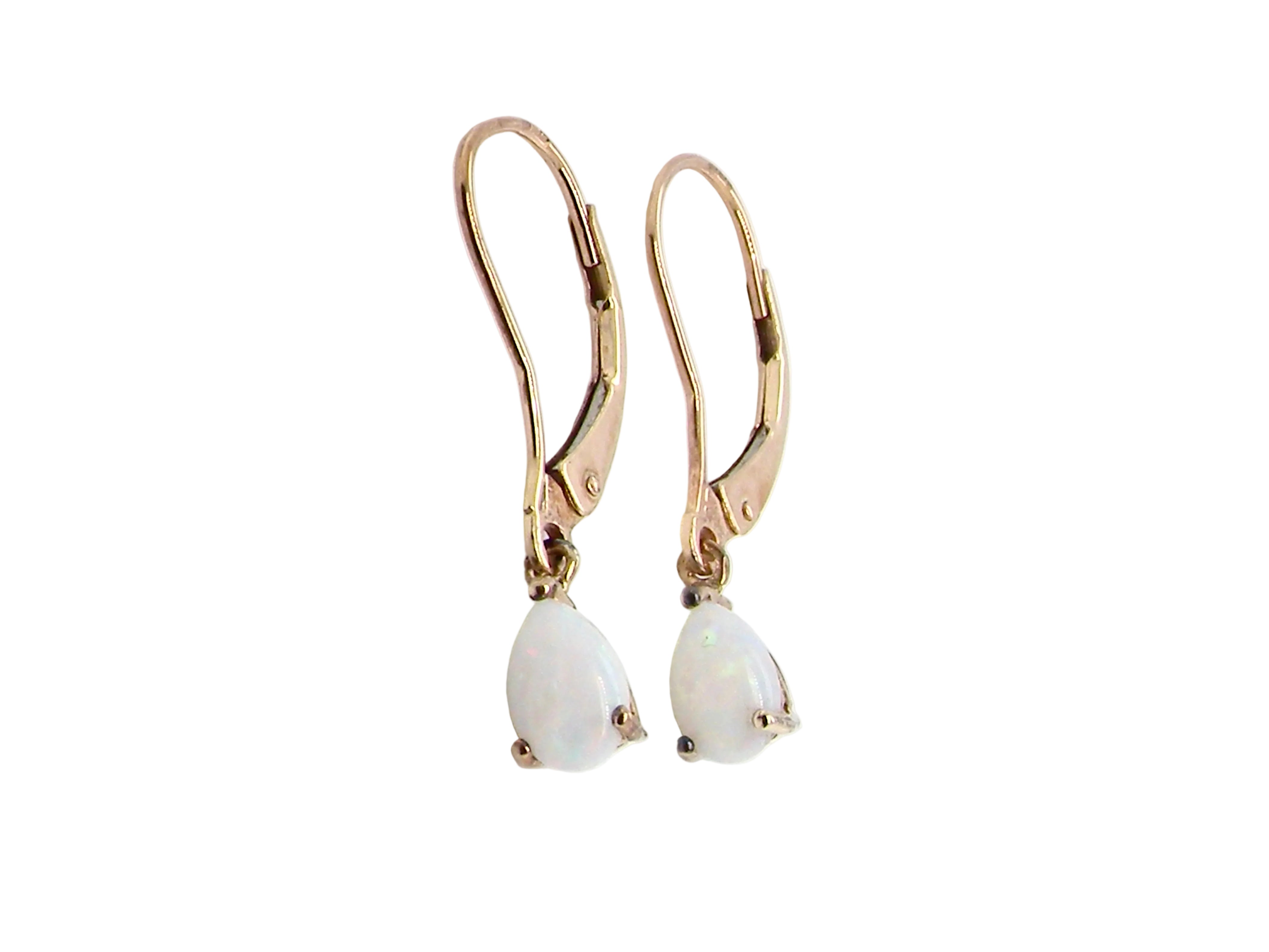 A pair of 9 carat gold drop earrings. Each set with a pear shaped white opal, 6x4mm.