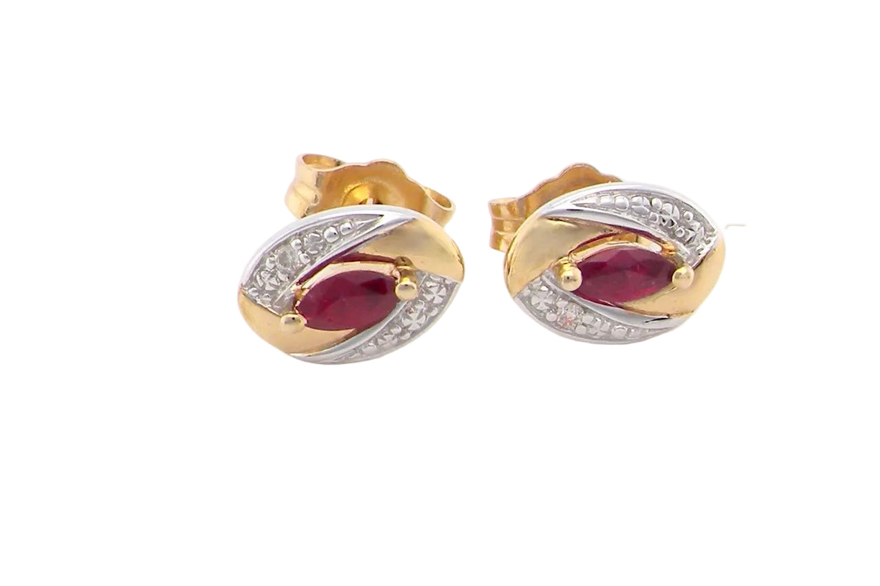 A pair of 9 carat gold earrings.
Centre stone a marquise cut ruby, 5x3mm