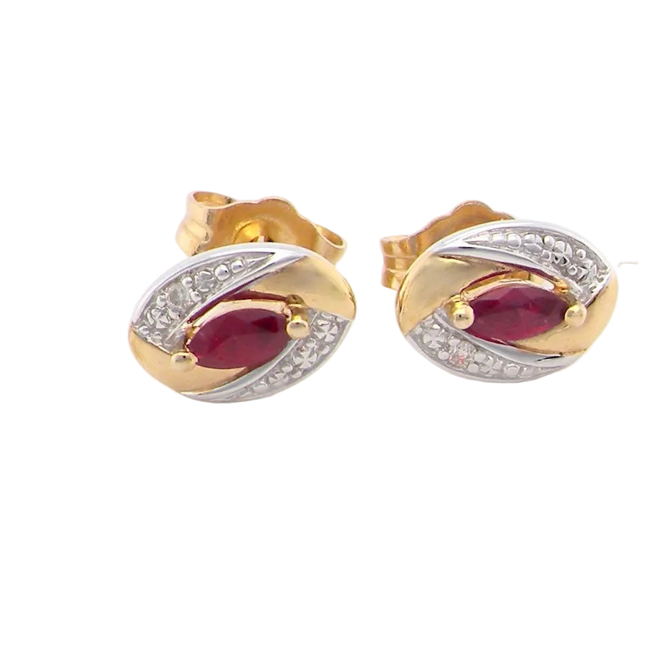 A pair of 9 carat gold earrings.
Centre stone a marquise cut ruby, 5x3mm