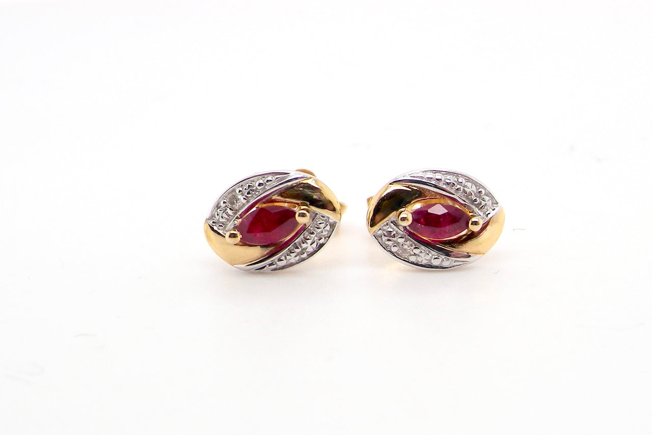 A pair of 9 carat gold earrings.
Centre stone an marquise cut ruby, 5x3mm
