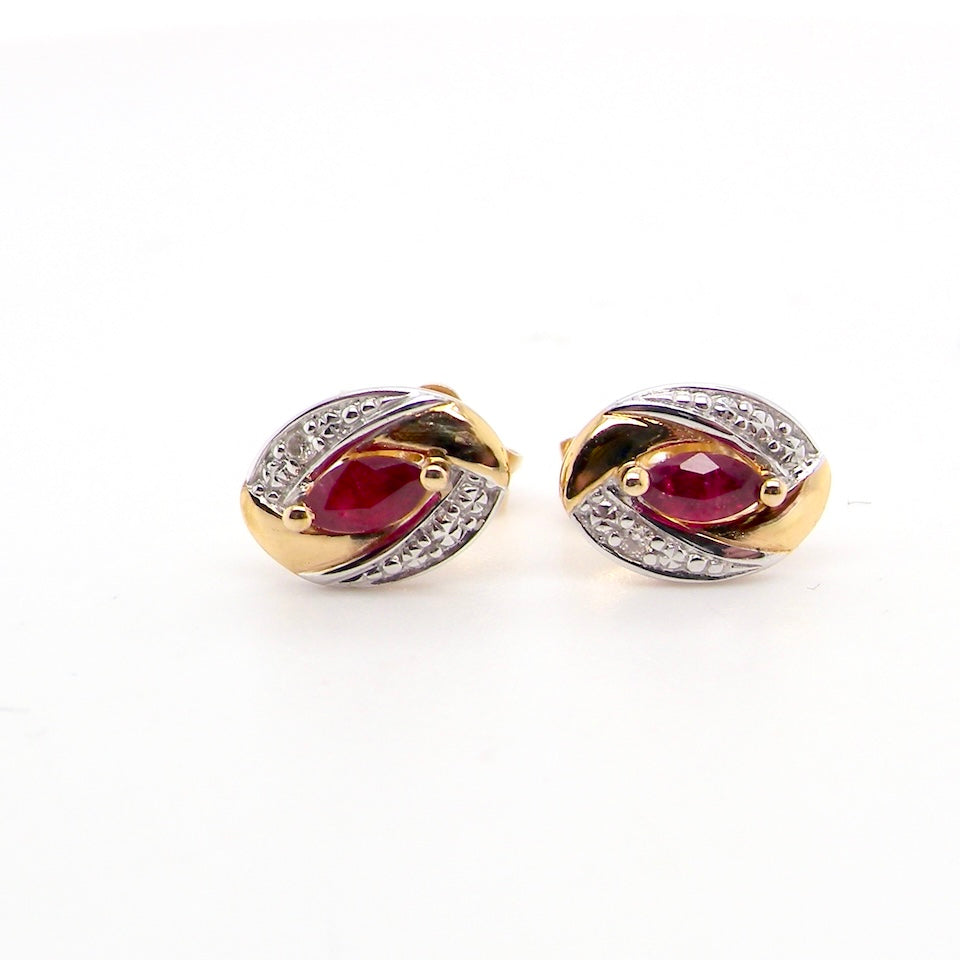 A pair of 9 carat gold earrings.
Centre stone an marquise cut ruby, 5x3mm