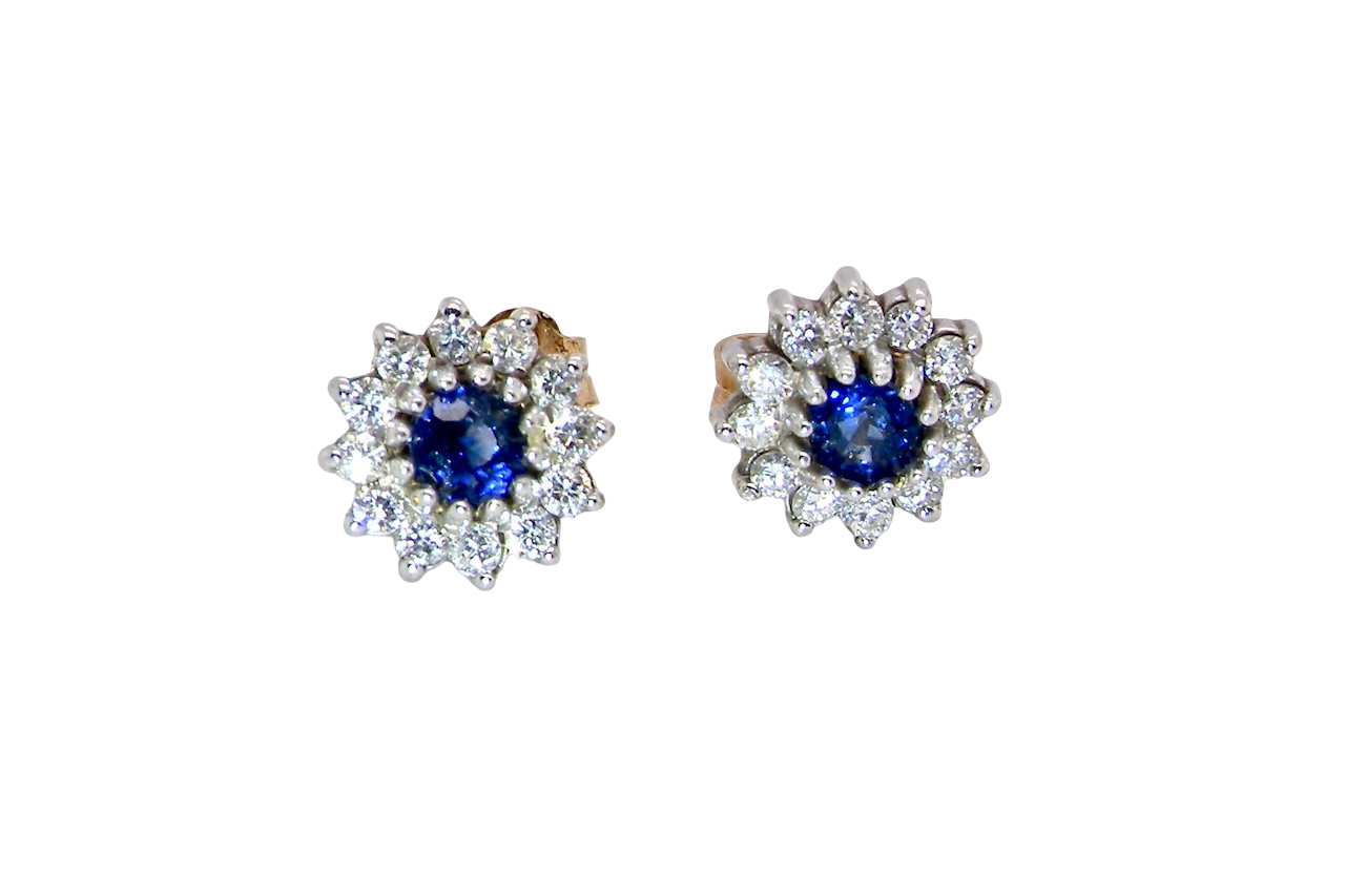 A pair of 9 carat gold earrings, set with a sapphire centre stone,
