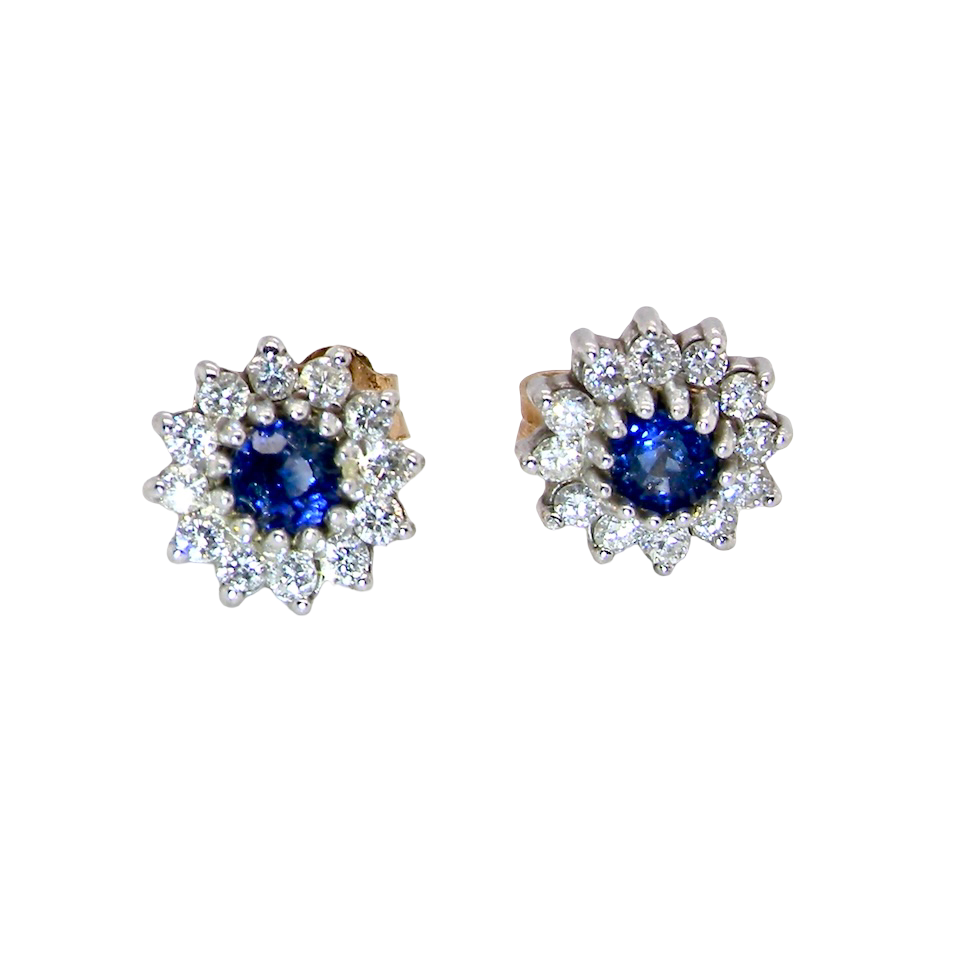 A pair of 9 carat gold earrings, set with a sapphire centre stone,