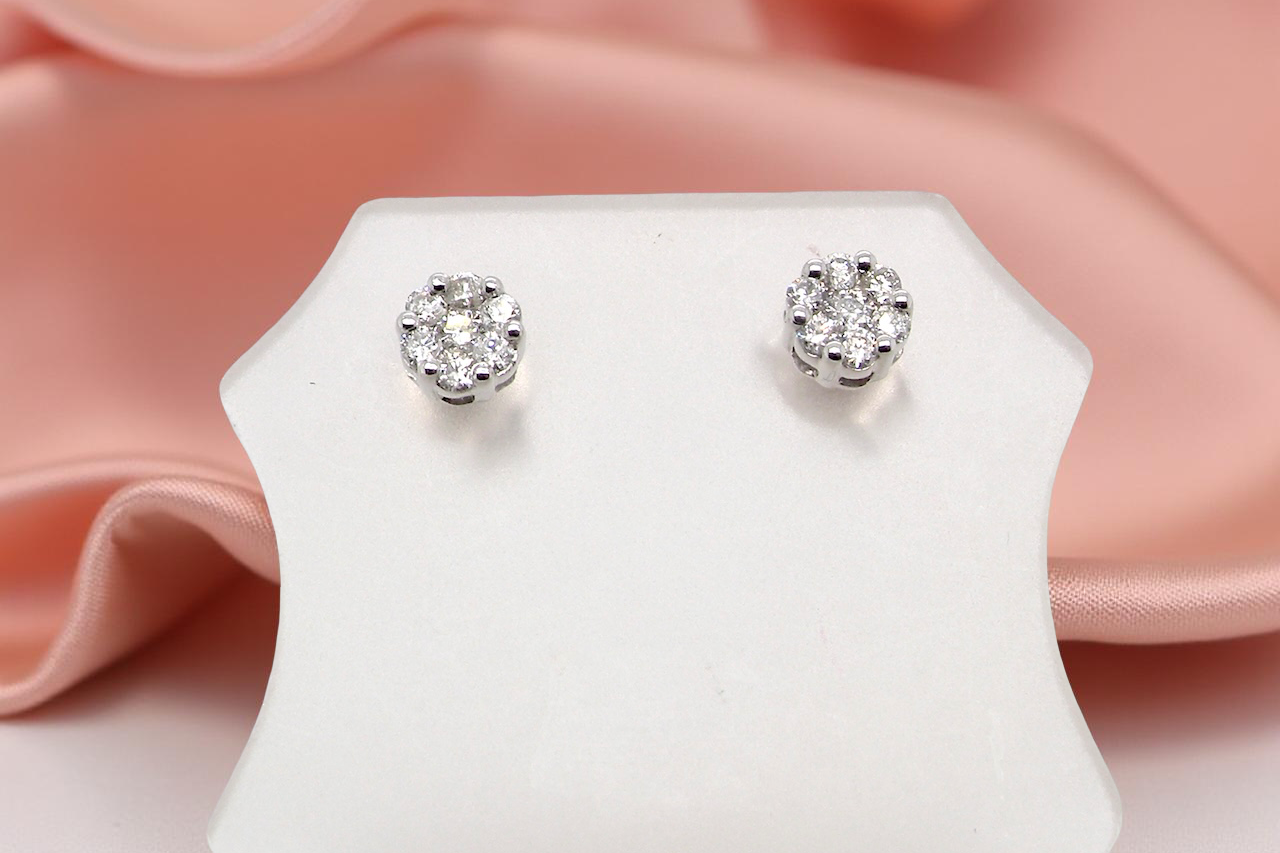 A pair of 9 carat white gold diamond stud earrings.
cluster