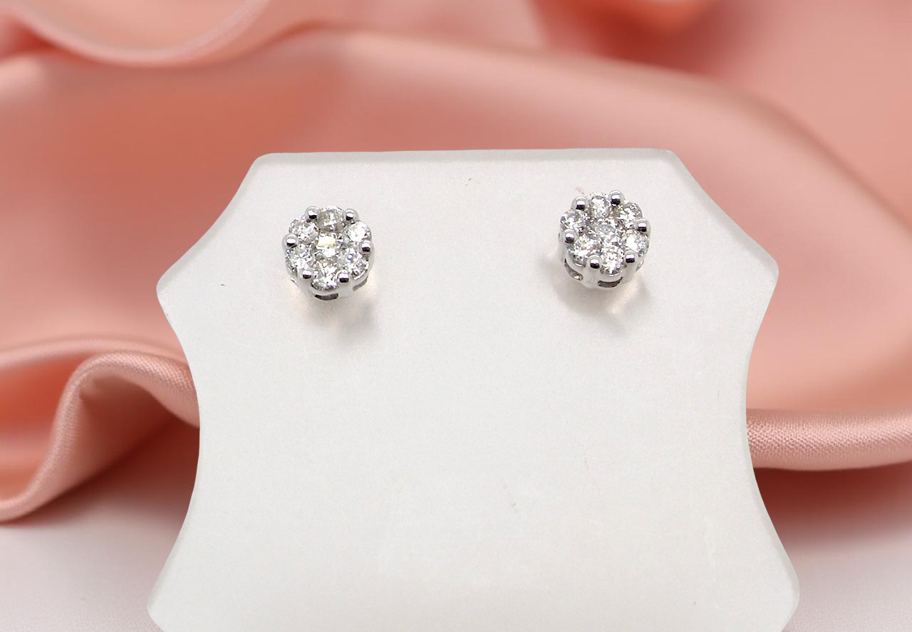A pair of 9 carat white gold diamond stud earrings.
cluster
