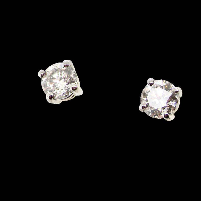 A stunning pair of classic diamond solitaire stud earrings, beautifully crafted in 18 carat white gold and featuring two sparkling brilliant cut white diamonds.