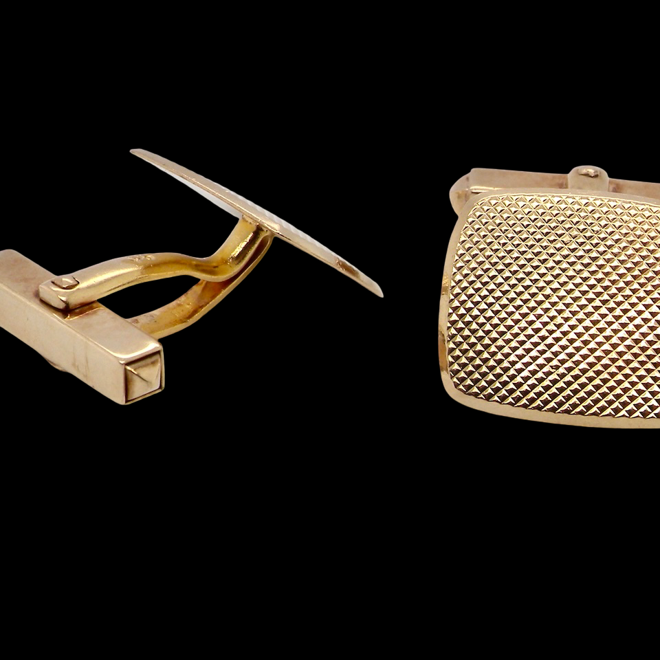 A pair of cushion shaped cufflinks. The head measures 17x15mm,