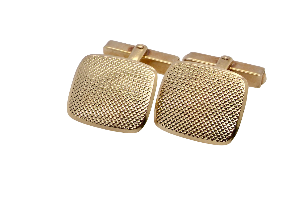 A pair of cushion shaped cufflinks. The head measures 17x15mm, engine turned pattern.