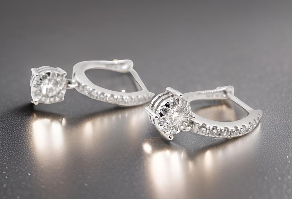 A pair of diamond hoop and drop earrings