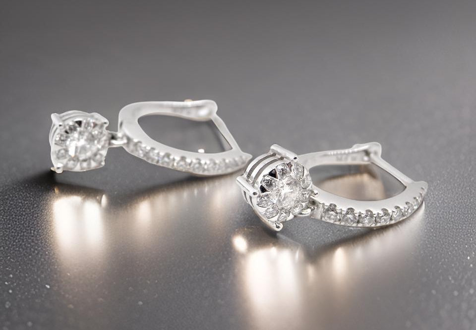 A pair of diamond hoop and drop earrings