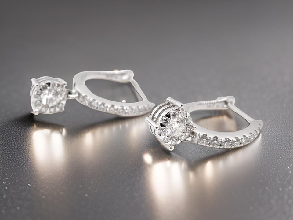 A pair of diamond hoop and drop earrings