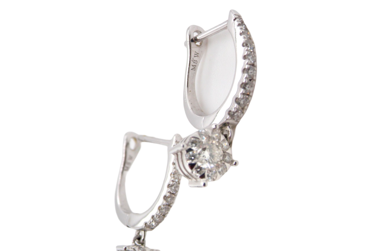 A pair of diamond hoop and drop earrings