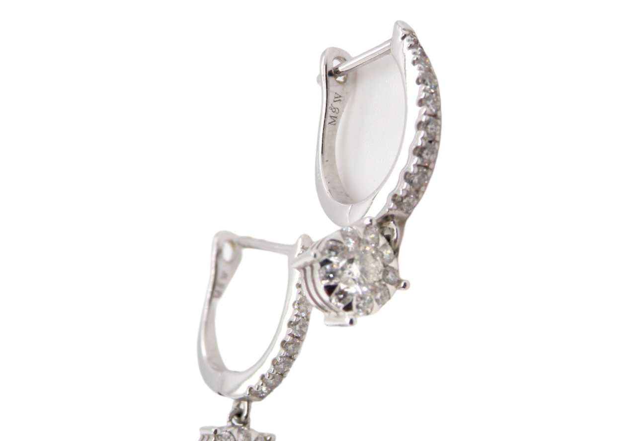 A pair of diamond hoop and drop earrings