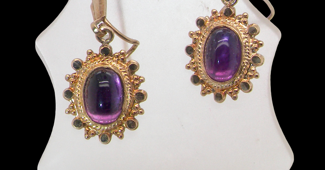 A pair of drop earrings. Each set with a cabouchon cut amethyst 6x4mm
