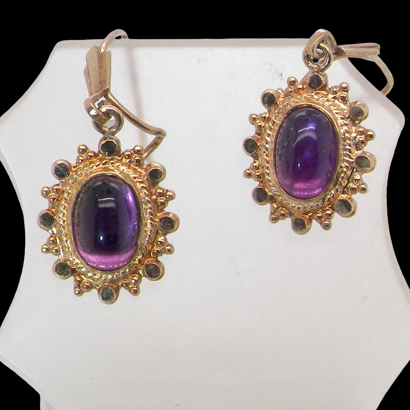 A pair of drop earrings. Each set with a cabouchon cut amethyst 6x4mm