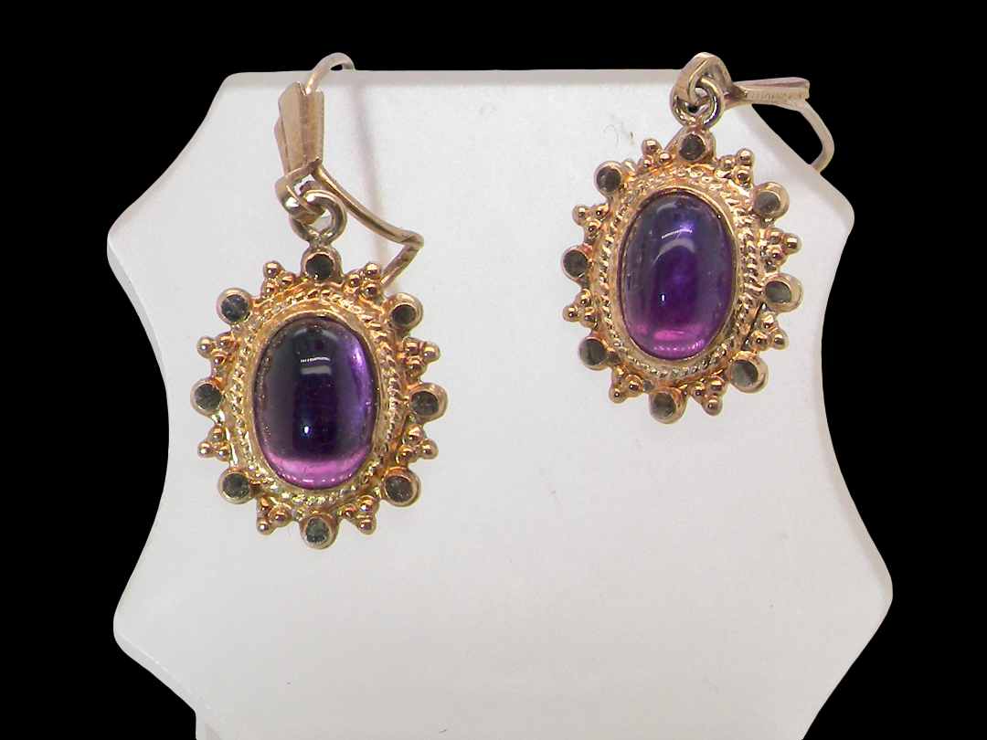 A pair of drop earrings. Each set with a cabouchon cut amethyst 6x4mm