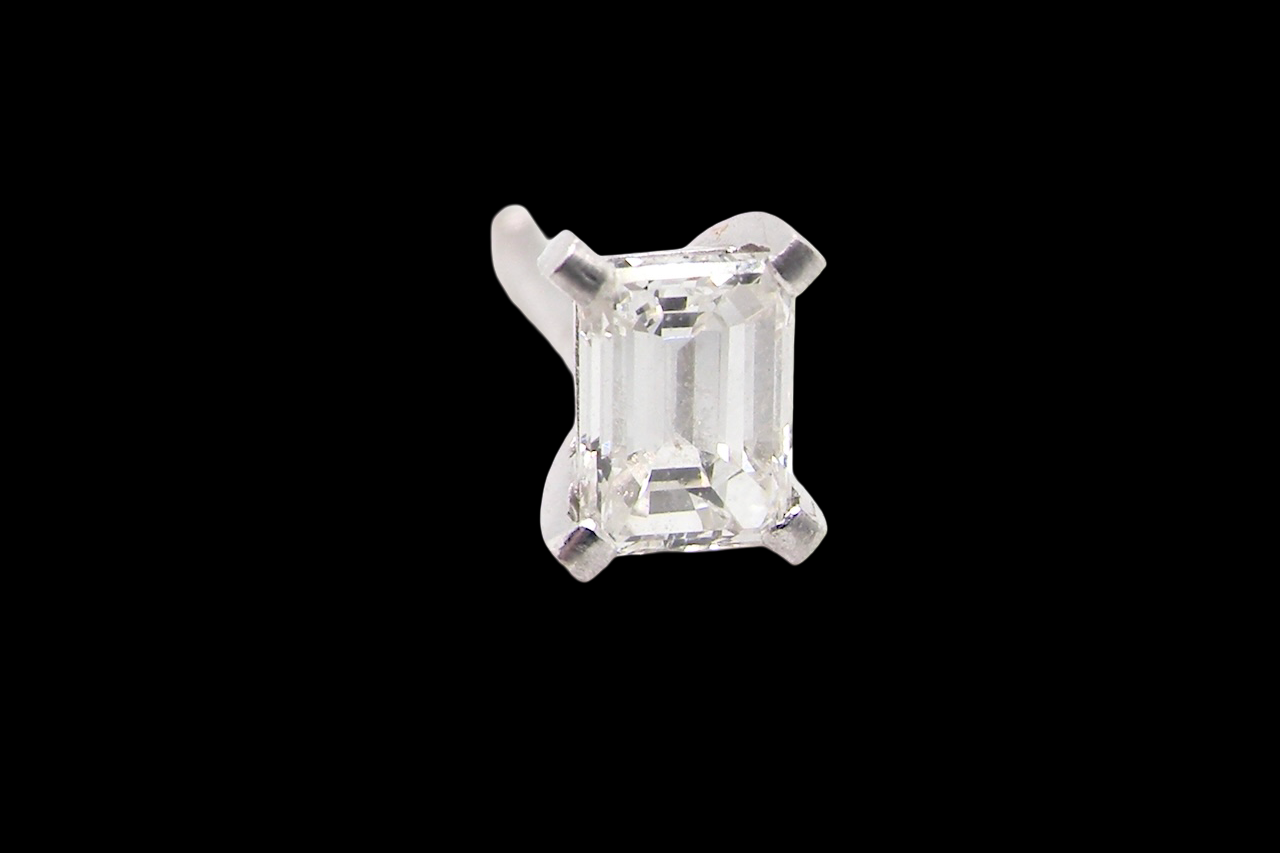 A pair of emerald cut diamond earring