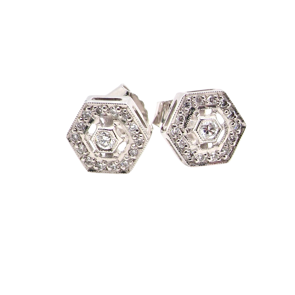 Hexagonal earrings with diamonds on a white background