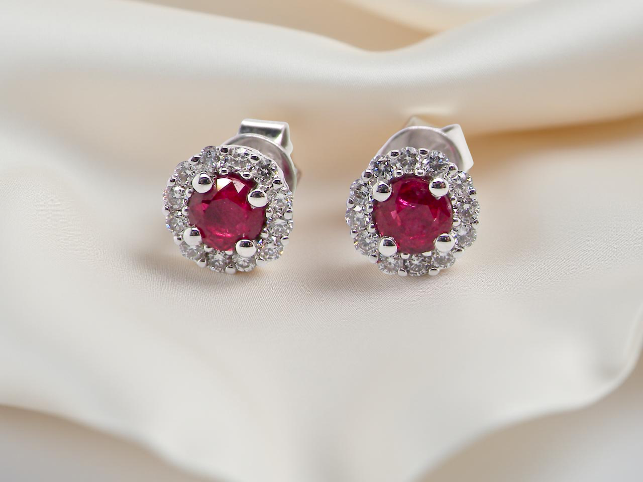 A pair of ruby and diamond earrings