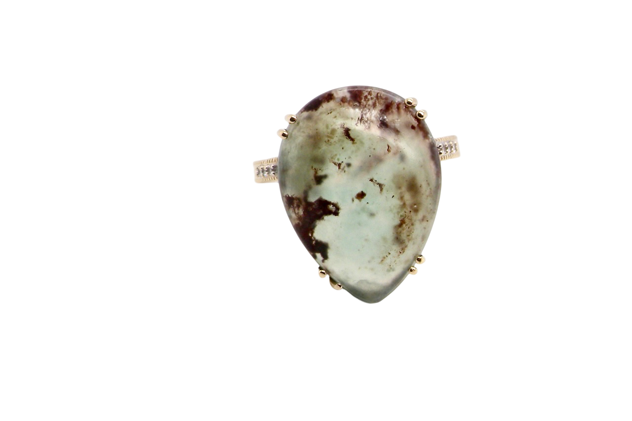 A pear shaped Moss Agate dress ring