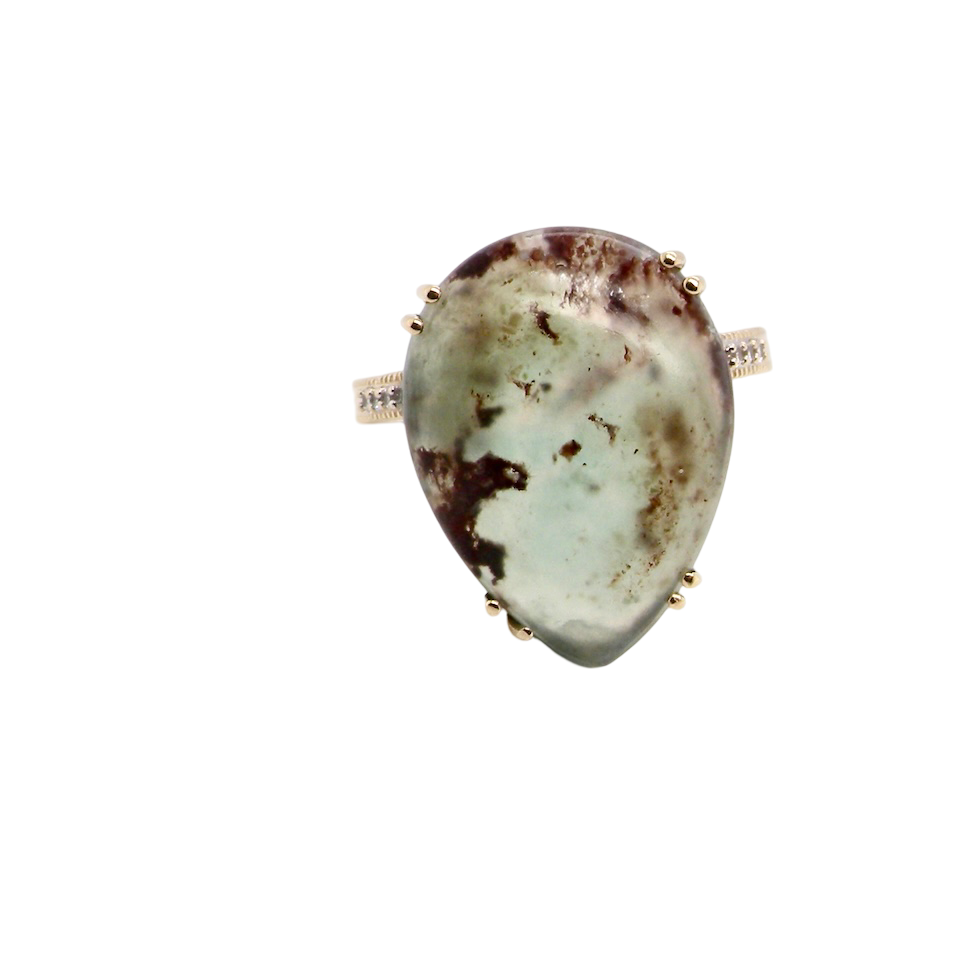 A pear shaped Moss Agate dress ring