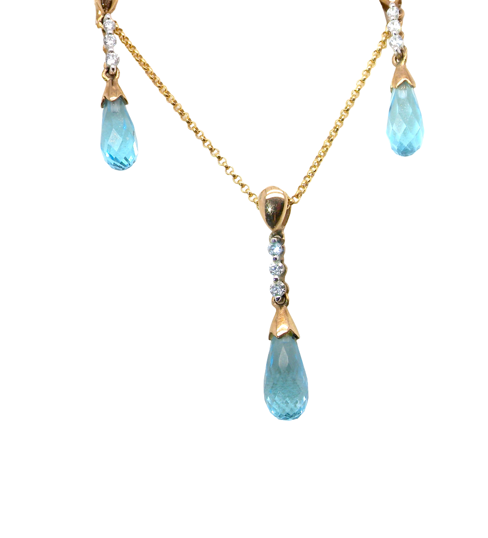 A pendant and earring set. The pendant has a pear shaped facet cut blue topaz 10x5mm. Above this three brilliant cut white cubic zirconia stones ,length 20mm.