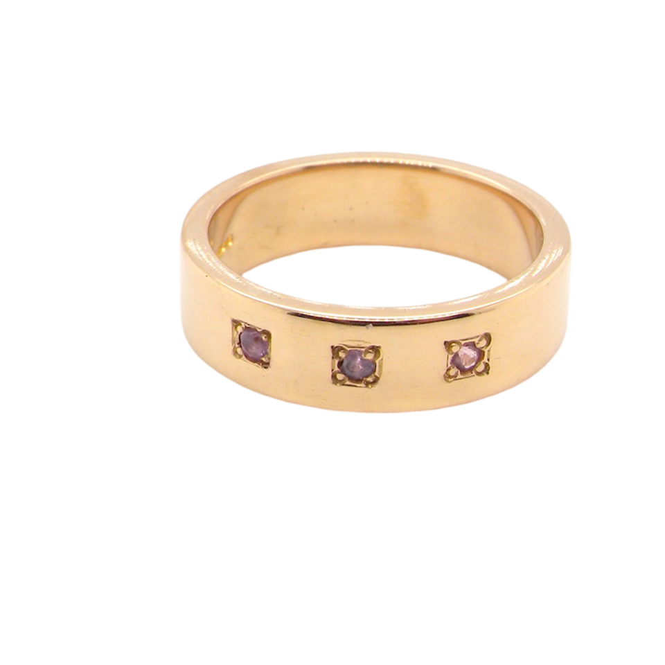 A pink sapphire wedding ring