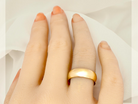 A plain 18 carat gold wedding ring