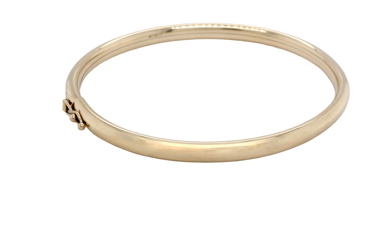 A plain 9 carat gold bangle