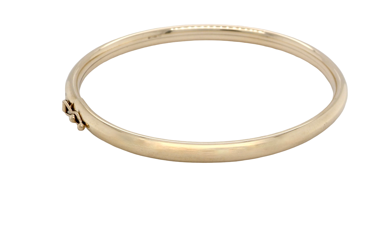 A plain 9 carat gold bangle