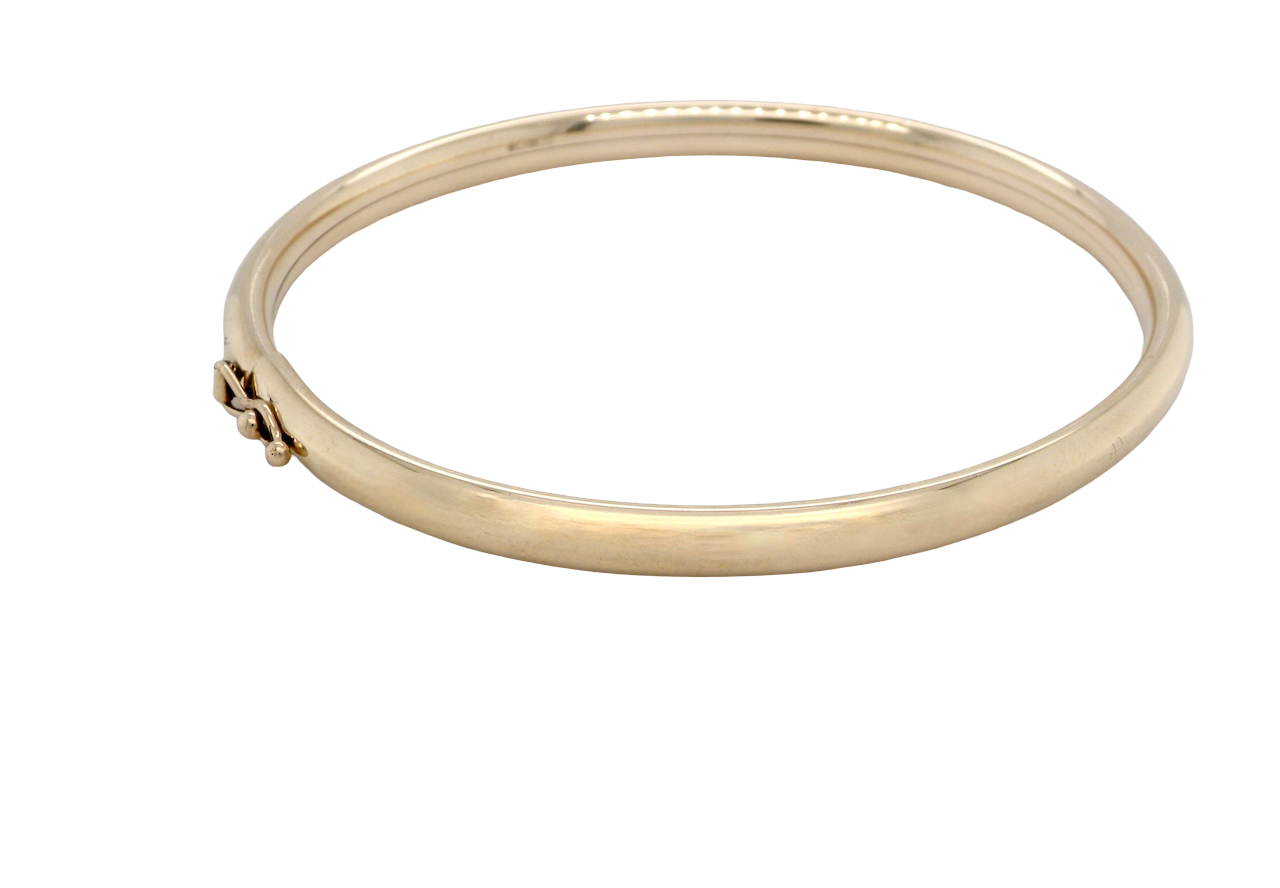 A plain 9 carat gold bangle