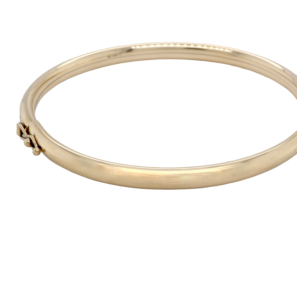A plain 9 carat gold bangle