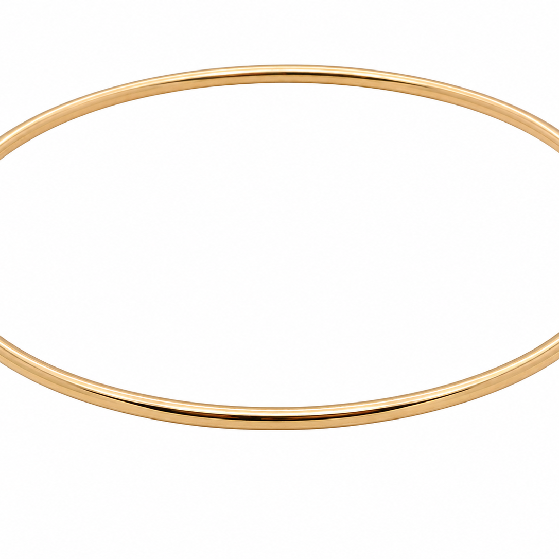 A plain 9 carat gold, solid bangle (formally known as a slave bangle) Weighs 7.3 grams, round wire profile, just under 2mm.