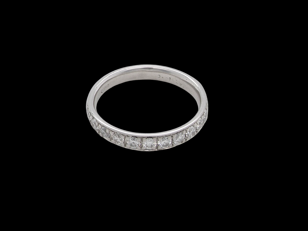 A platinum half hoop diamond eternity ring