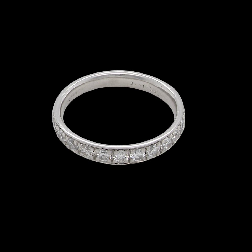 A platinum half hoop diamond eternity ring