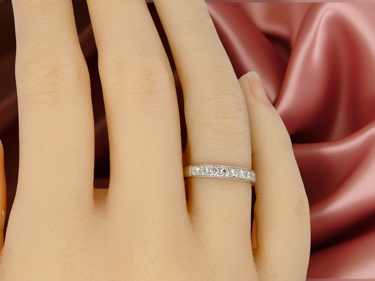 A platinum half hoop diamond eternity ring