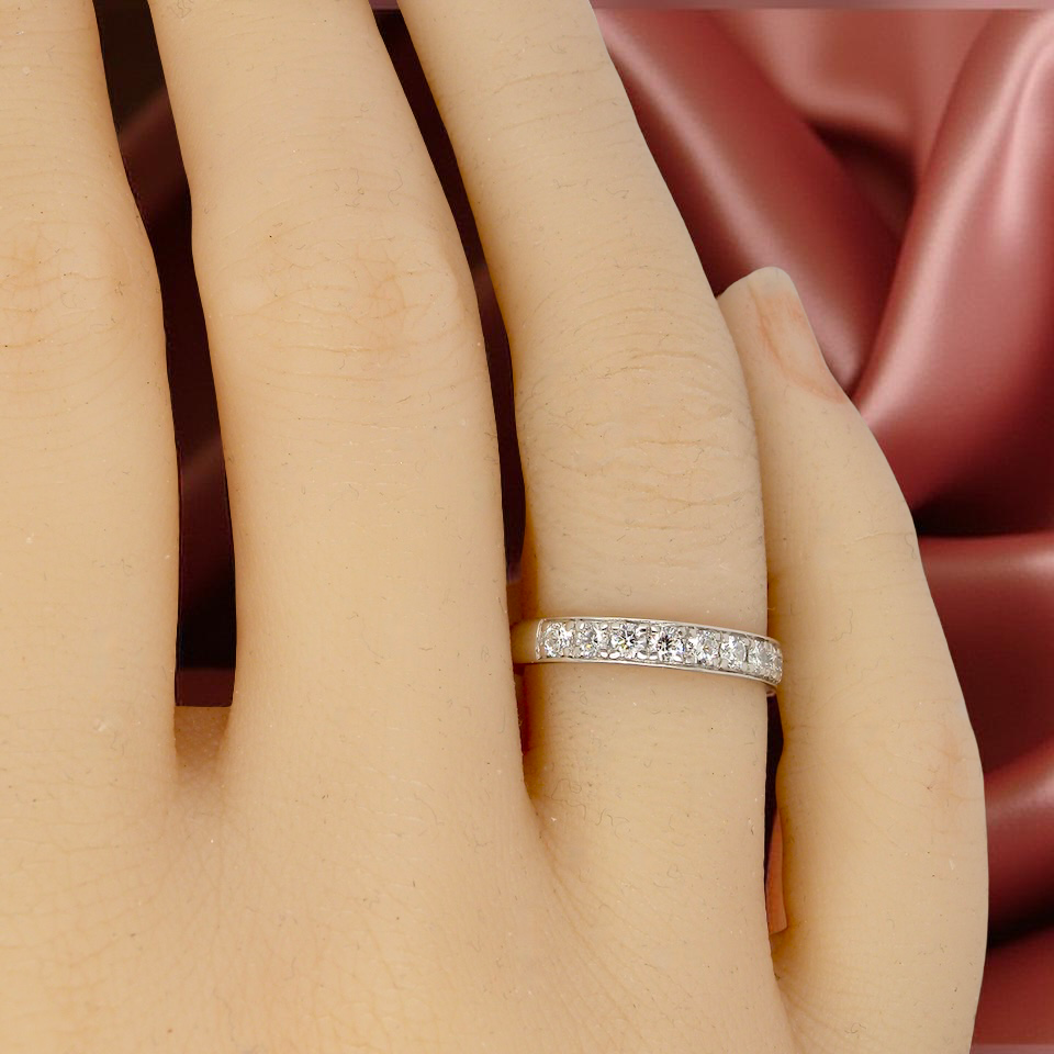 A platinum half hoop diamond eternity ring