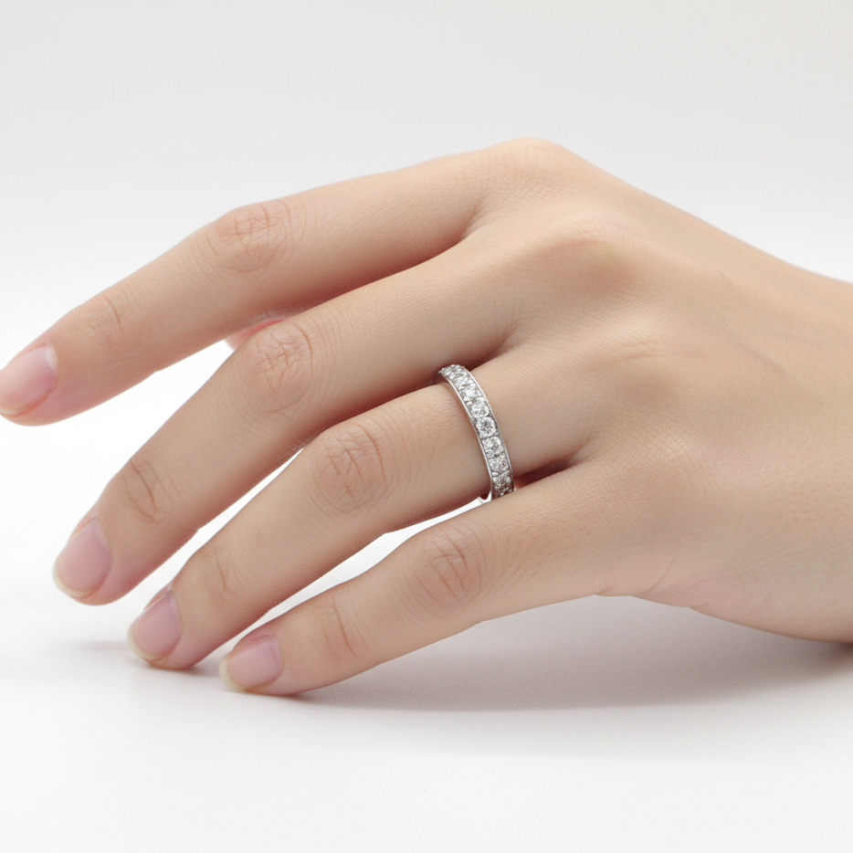 A platinum half hoop diamond eternity ring