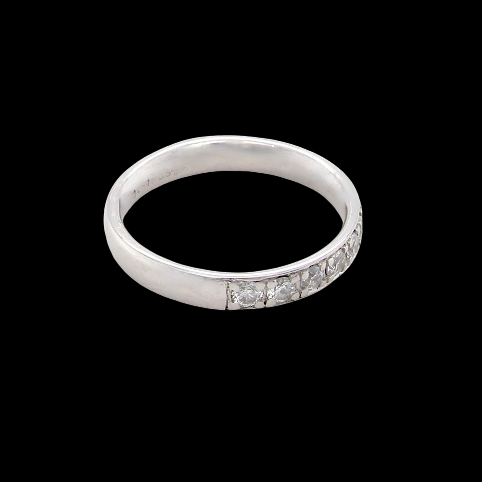 A platinum half hoop diamond eternity ring