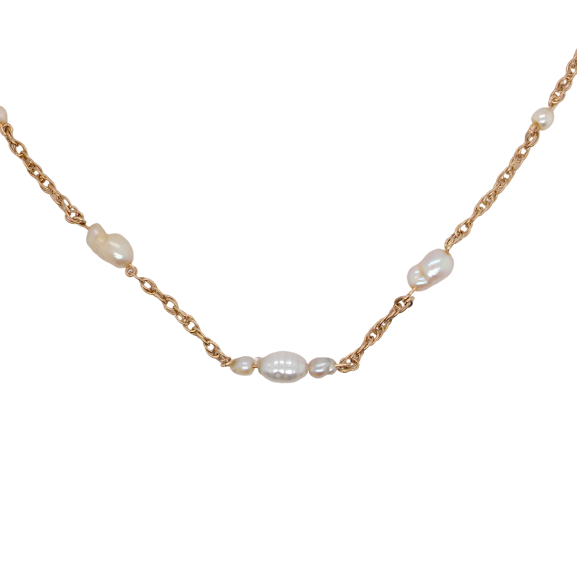 A delicate gold chain necklace featuring irregular white baroque pearls spaced along the chain, displayed on a clean white background.