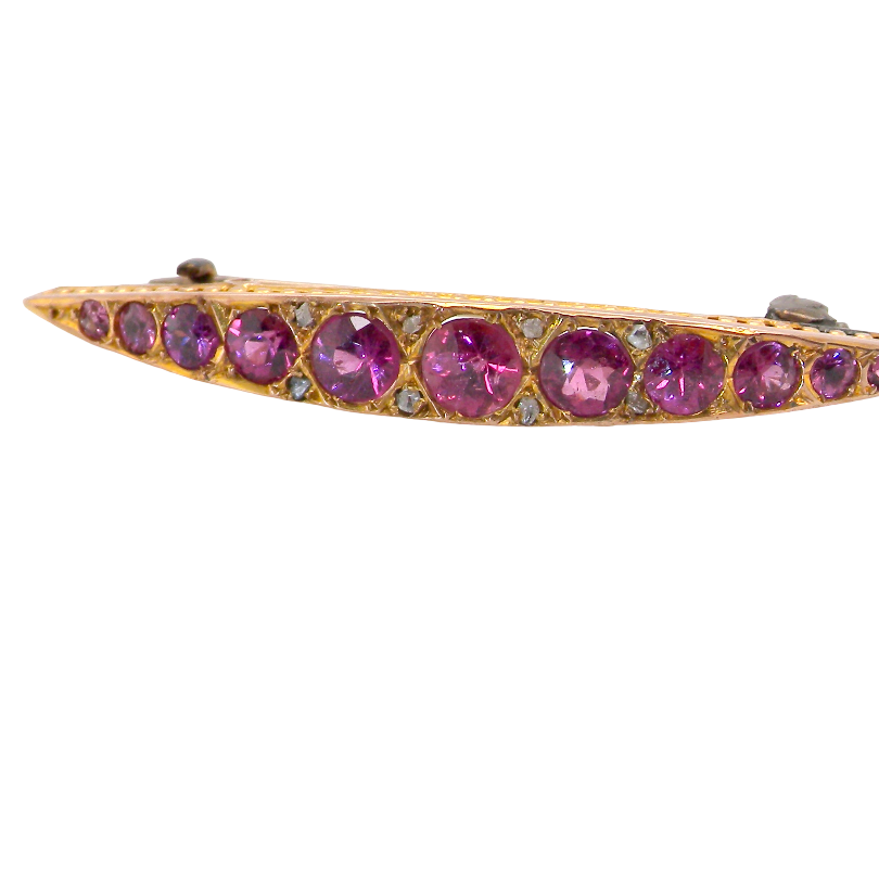 A pretty Victorian crescent shaped brooch. The principal stones are almandine garnets