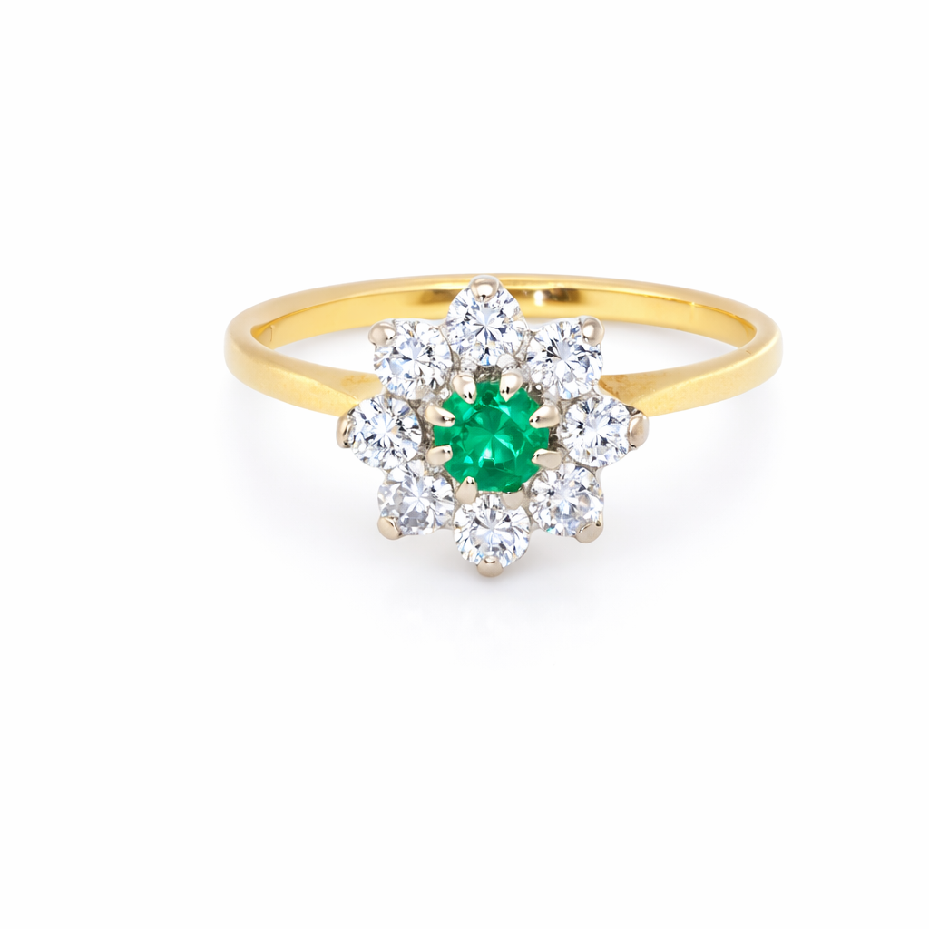 A pretty cluster ring that features a round emerald