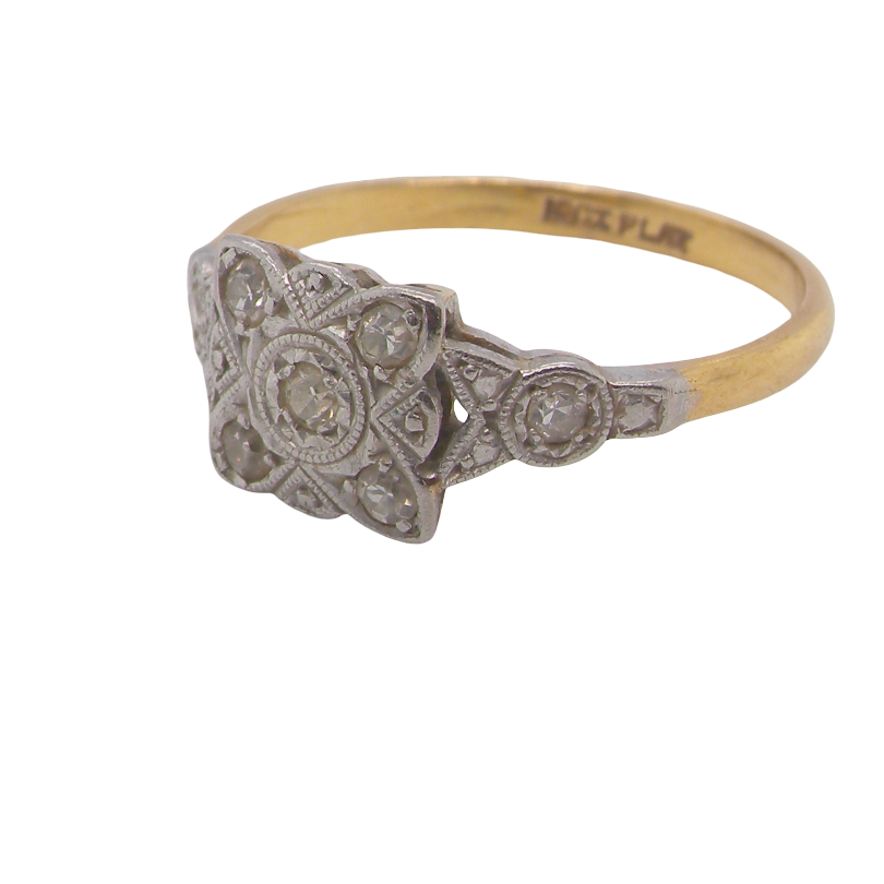 A pretty diamond cluster ring from the early part of the 20th century. A square head that has within it small white diamonds, measures 8x8mm, fancy shoulders also set with tiny diamonds.side